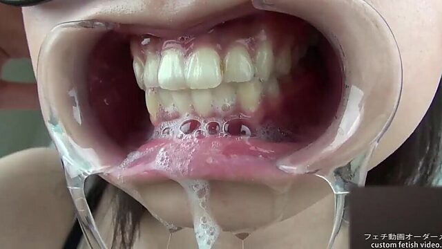 Japanese fetish woman drools and exposes her gums