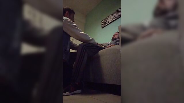 Dude chills on couch while chick eagerly sucks his cock