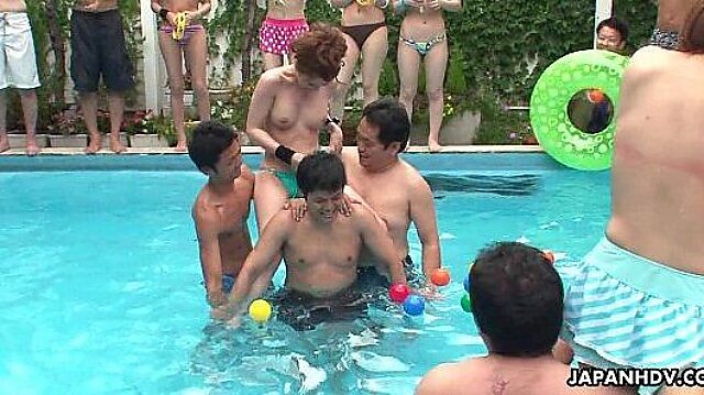 Japanese babes ride big cocks by the pool