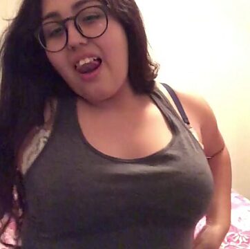 Hot Latina with a belly bump pleasures herself