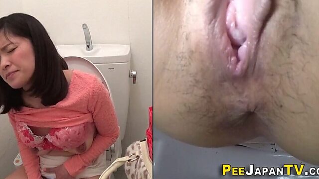 Asian babe self pleases with pee soaked toys