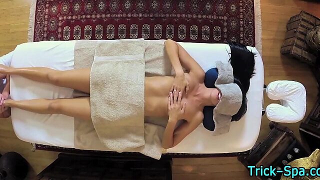 Amateur babe gives footjob during massage