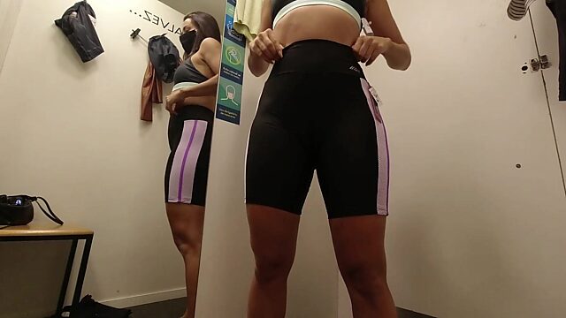 Naughty couple tries on gym clothes and gives blowjob in shopping mall fitting room - Exclusive content available on heyya's OnlyFans!